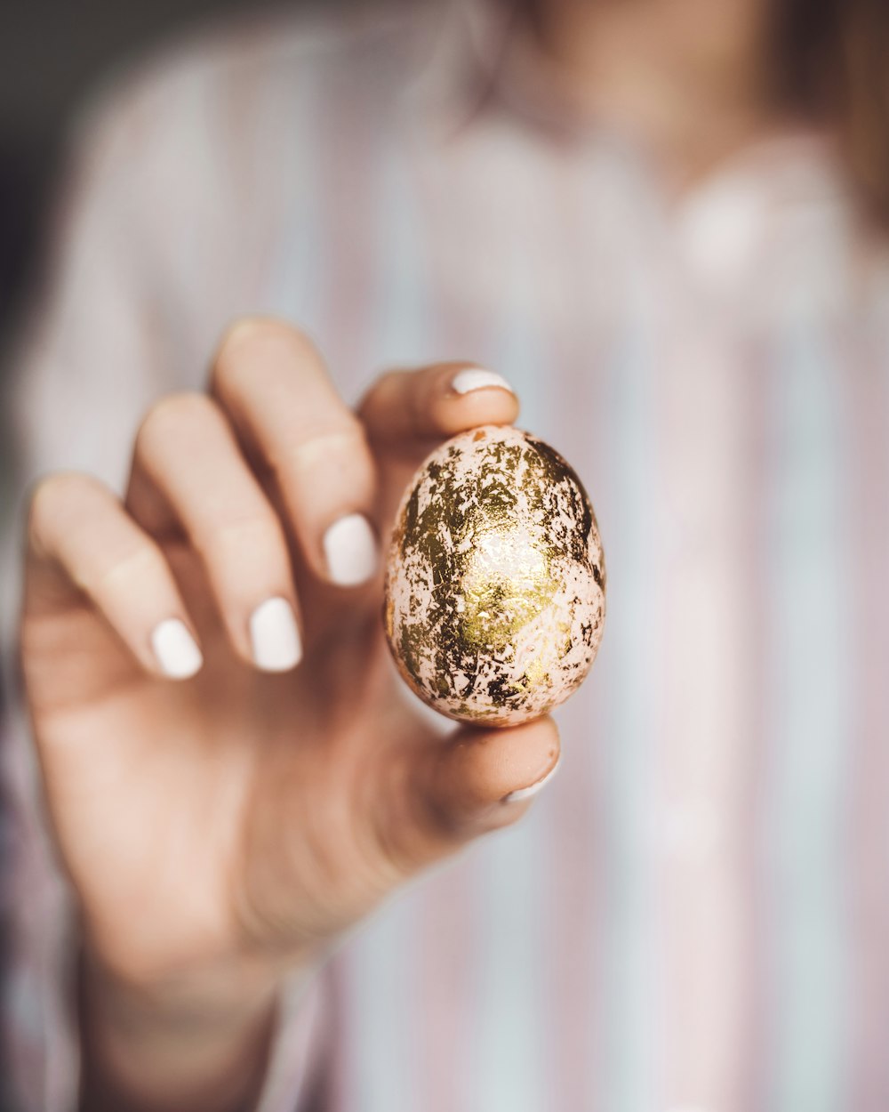 woman holding egg