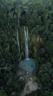 selective focus photography of waterfalls during daytime