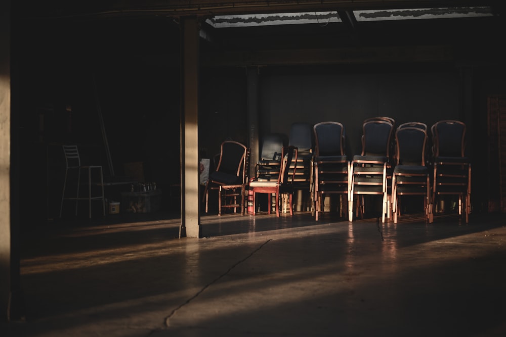 pile of chairs beside on wall