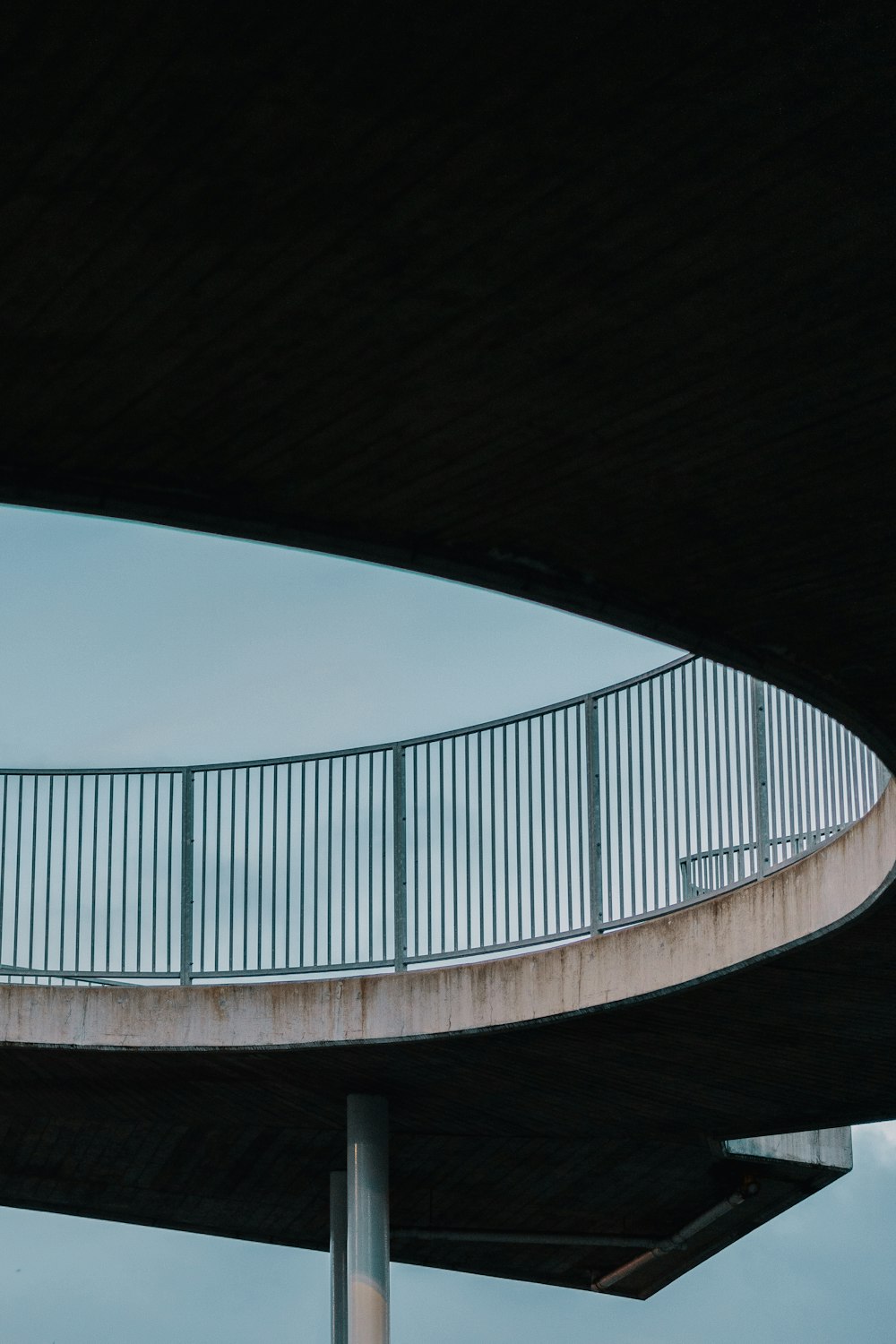 a man riding a skateboard under a bridge