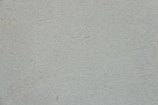 Close-up of textured atérmico wall covering in neutral tones.
