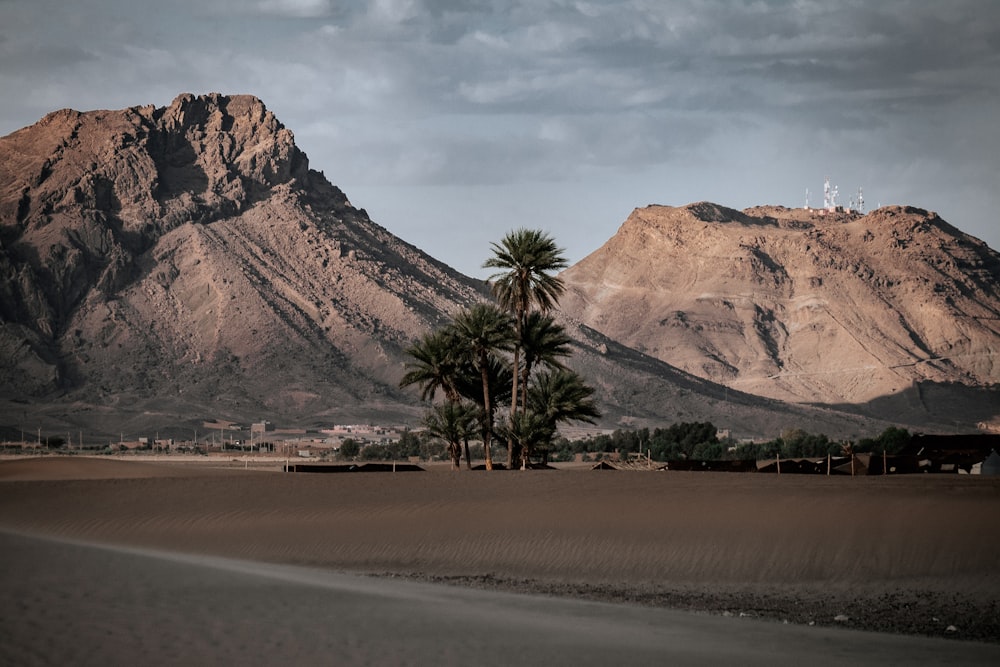 landscape photo of brown mountains under cloudy sky during daytime