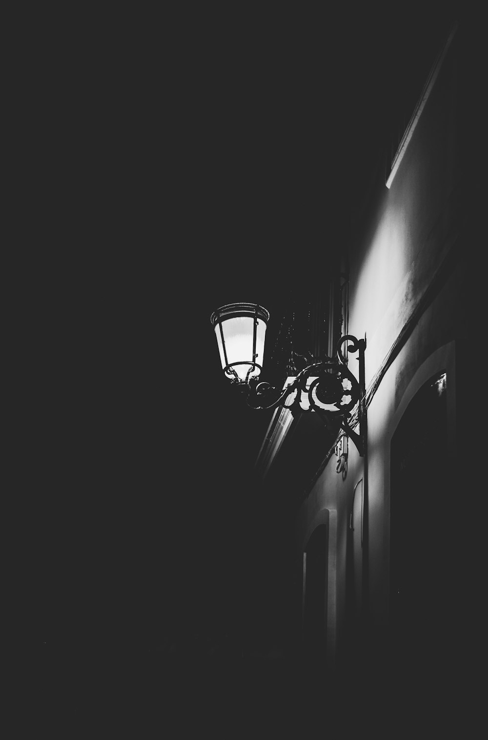 grayscale photography of wall light