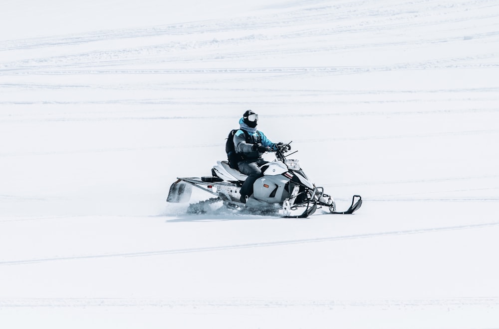 person riding snow mobile