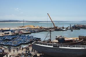 boats on water under blue sky