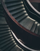 Close-up cinematic shot of a sleek interior staircase with ambient lighting.
