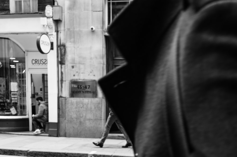 grayscale photography of person in collared top