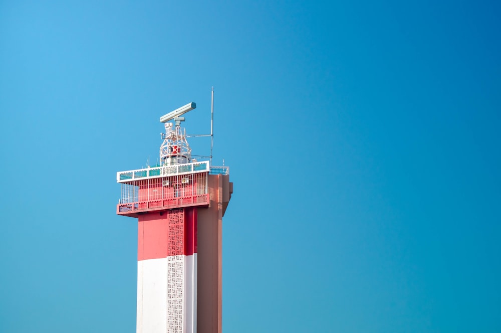 pink and white concrete tower at daytime