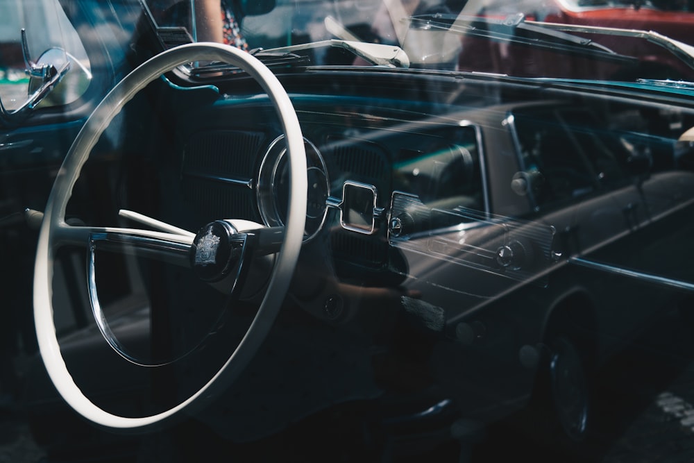selective focus photography of vehicle steering wheel