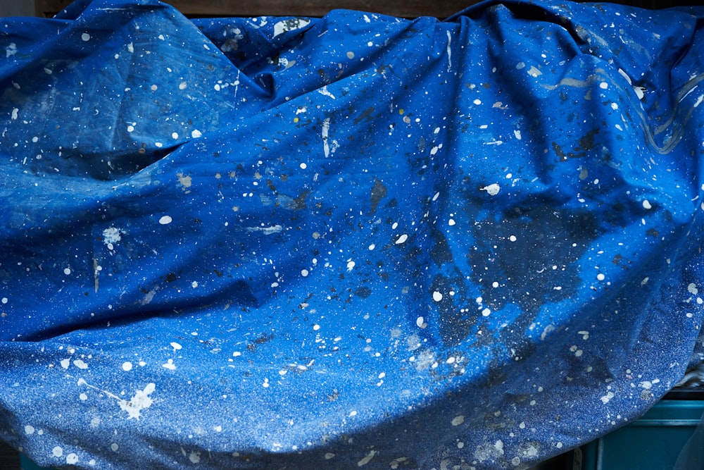 a blue cloth covered in white speckles