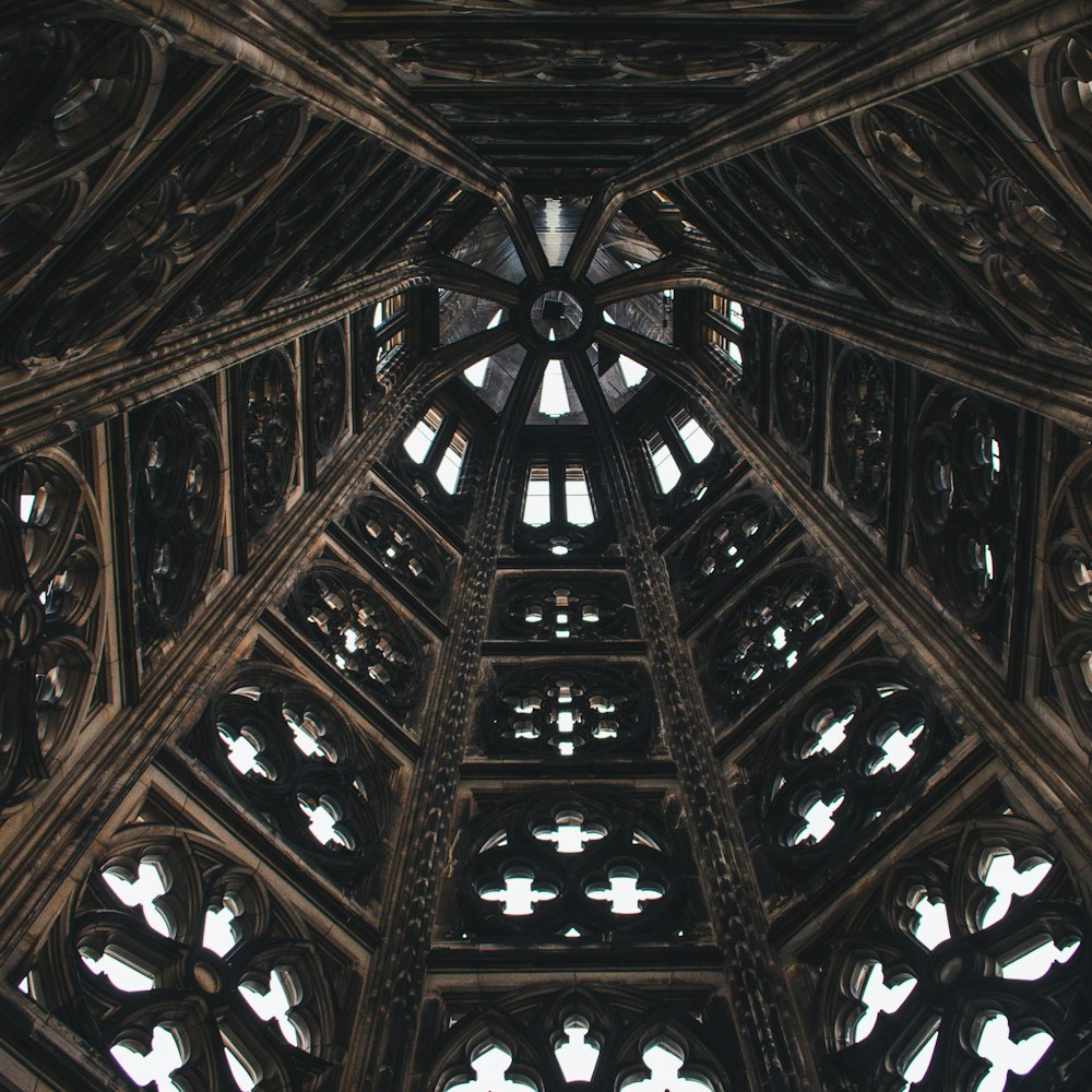 the ceiling of a building with many windows