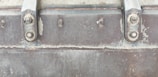 Close-up of a zinc-rich primer applied on heavy machinery in a mining site.