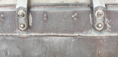 Close-up of a zinc-rich primer applied on heavy machinery in a mining site.