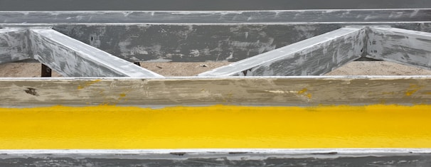 Wall section showing the brown anti-termite coating protecting wood.