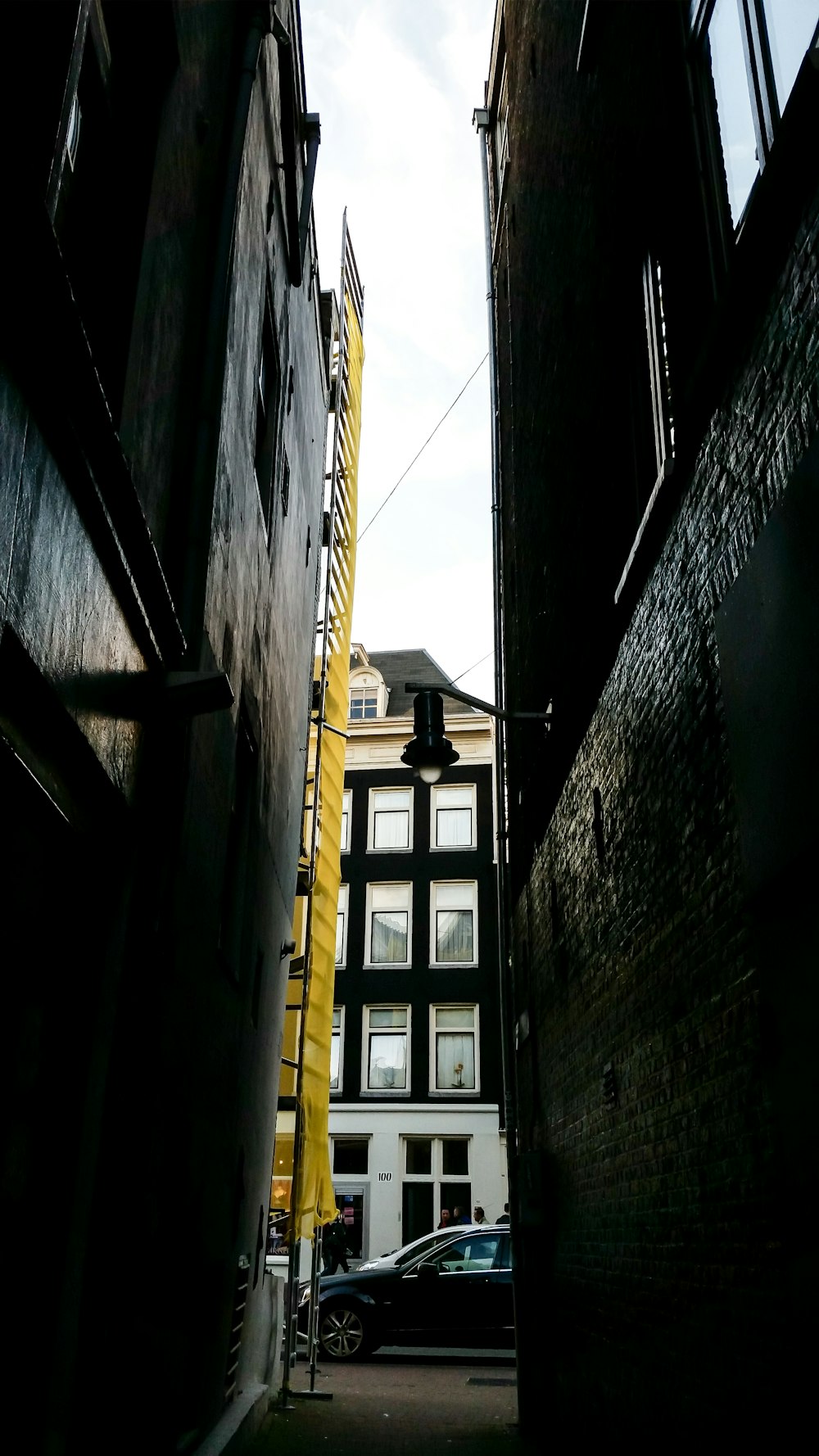 black vehicle parked beside building