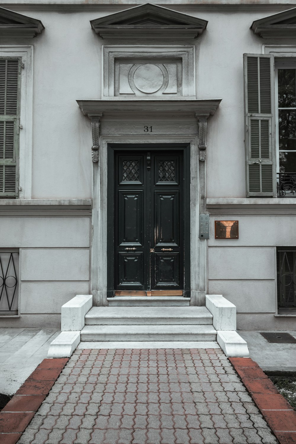 black and white concrete house with closed door