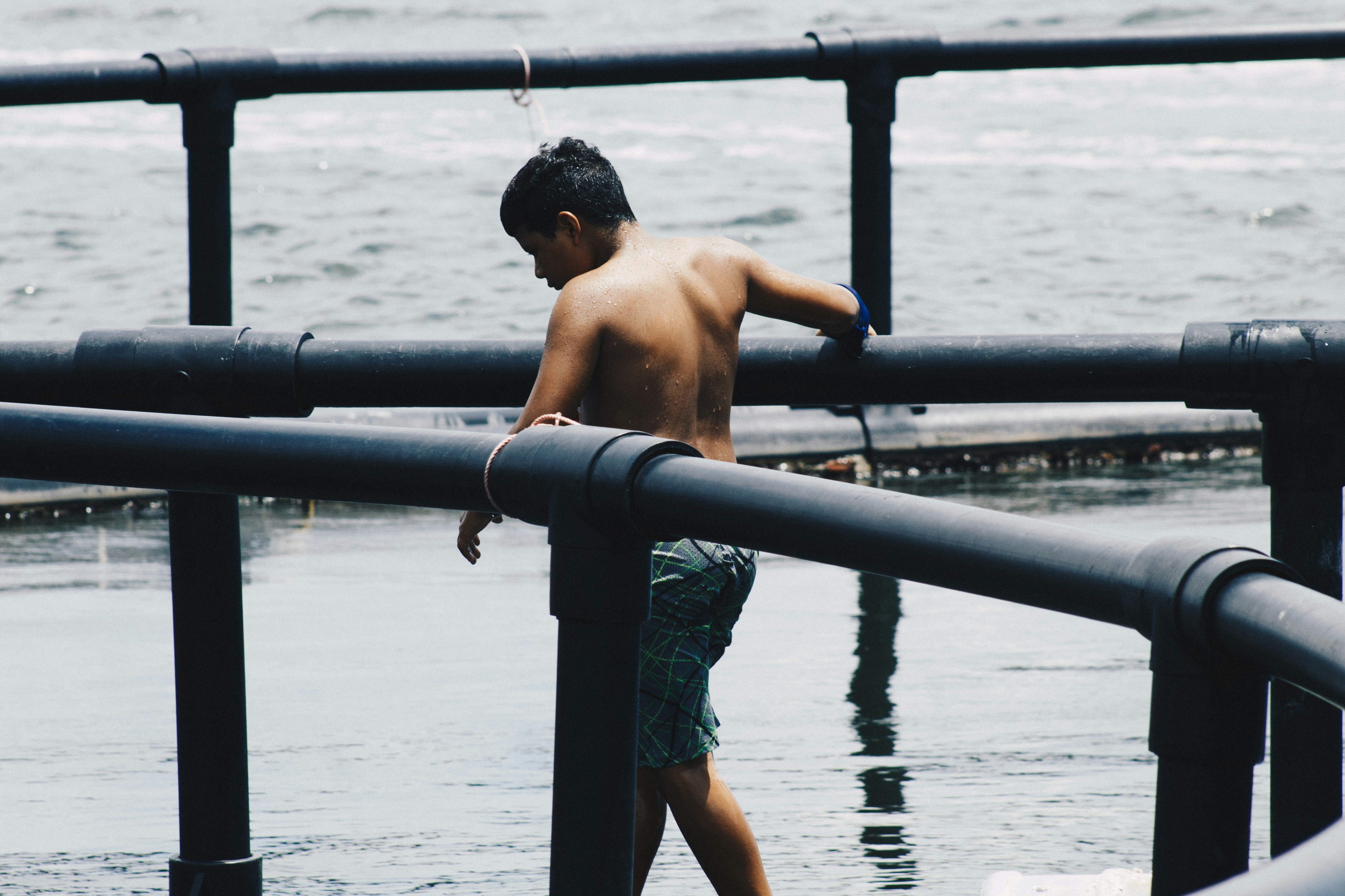 Topless man walking on water
