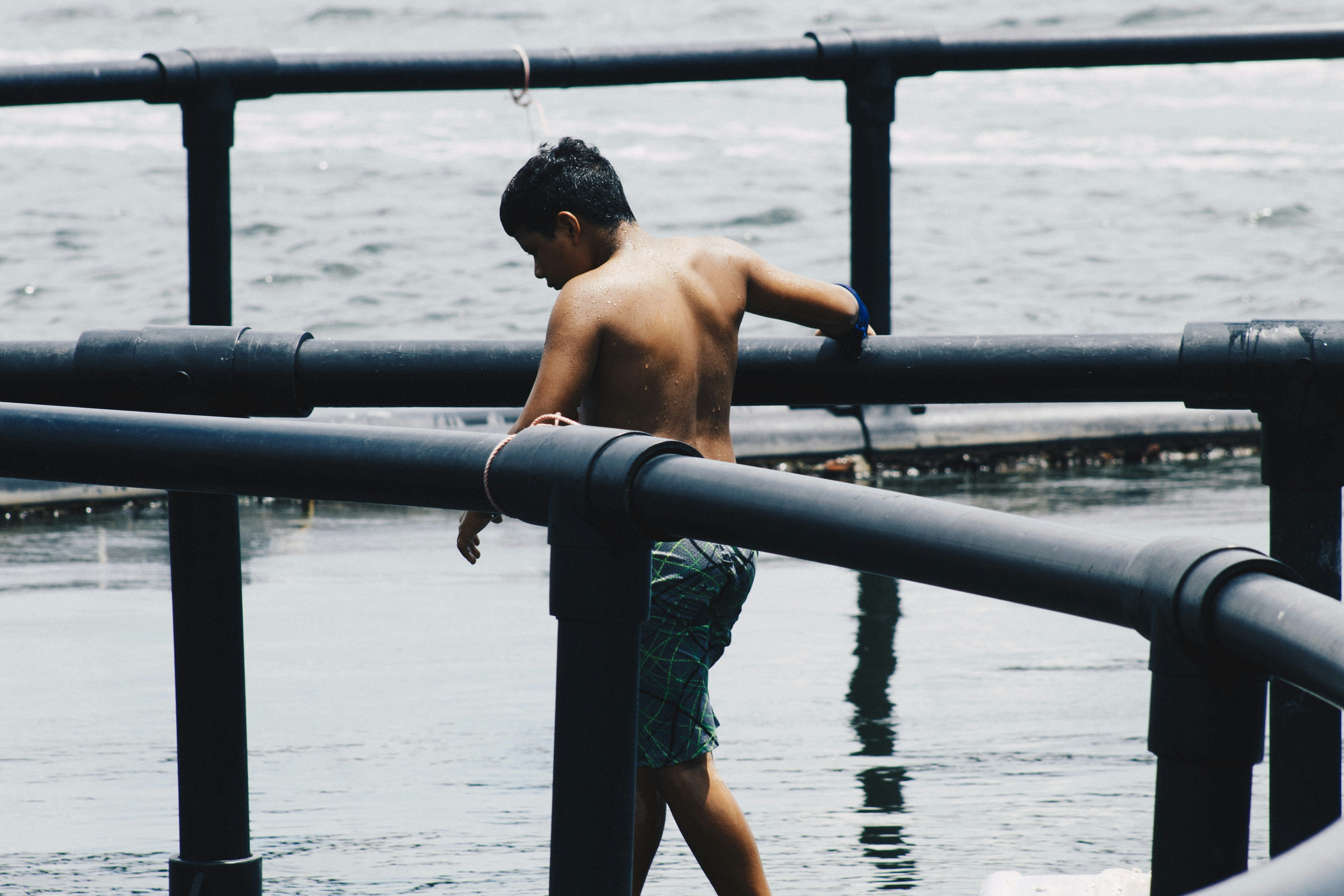 topless man walking on water