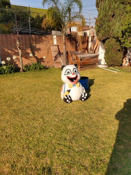 A cheerful panda holding a shiny coupon with a silky ribbon background.