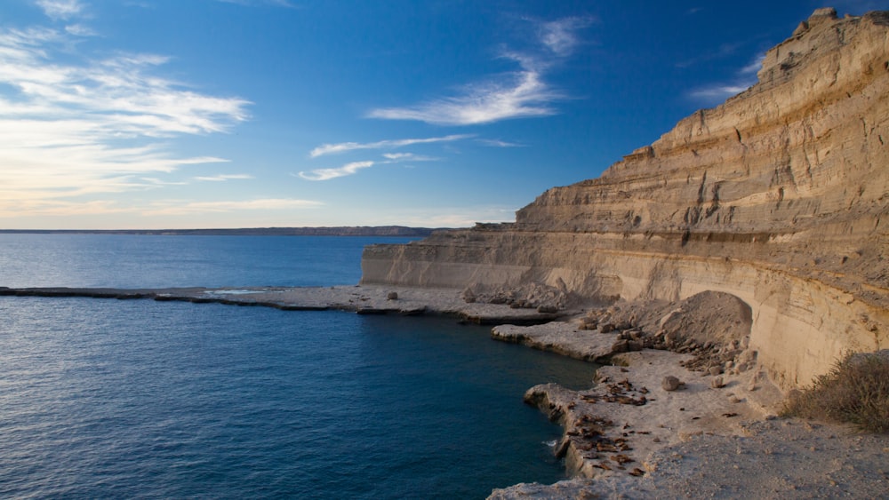 brown cliff near ocean