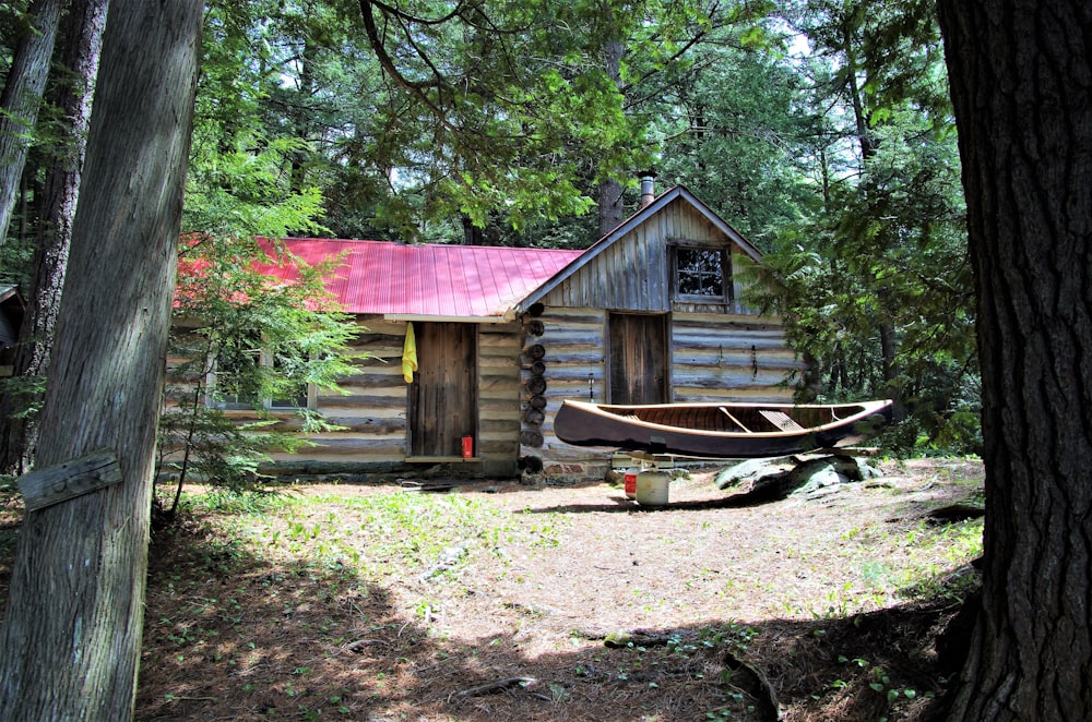 brown house near green-leafed trees during daytime