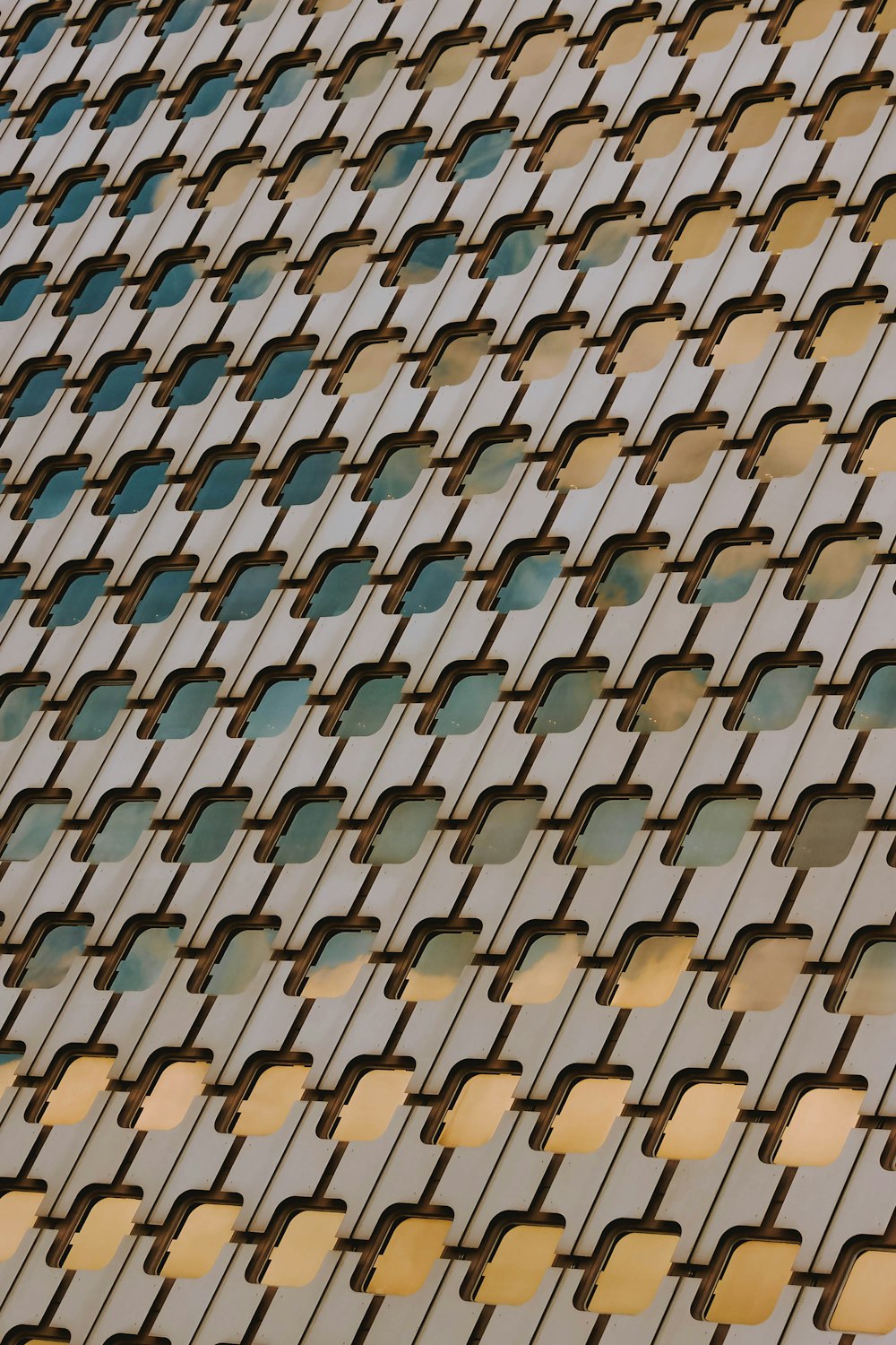 a close up of a building with a clock on it's side