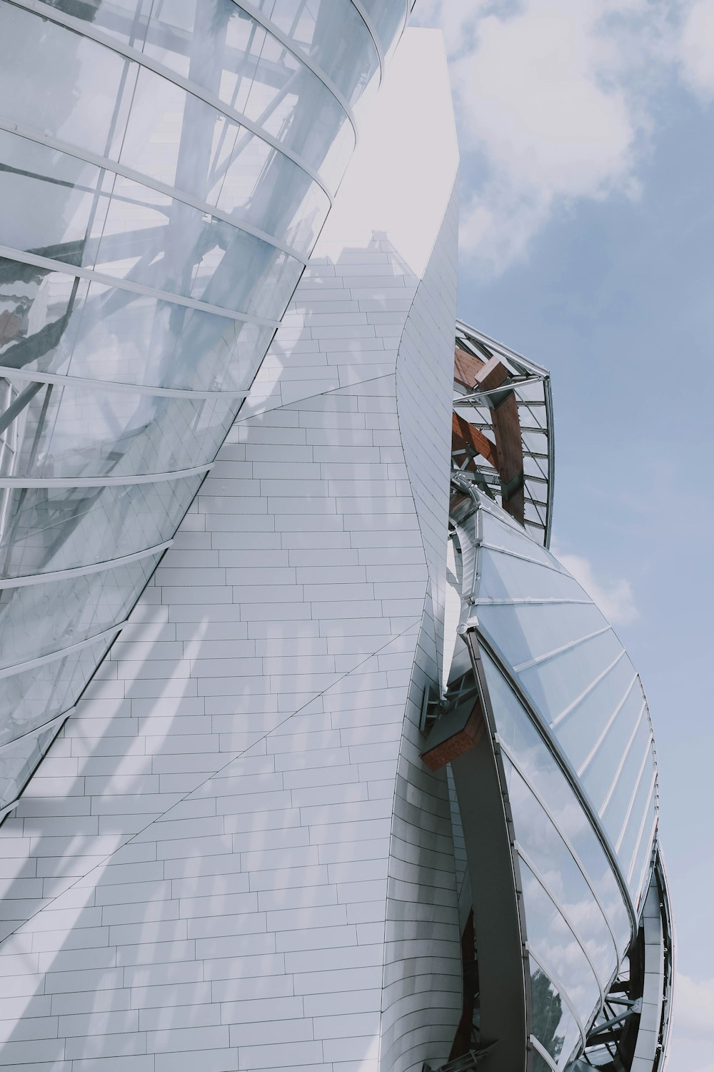 a tall white building with a sky background