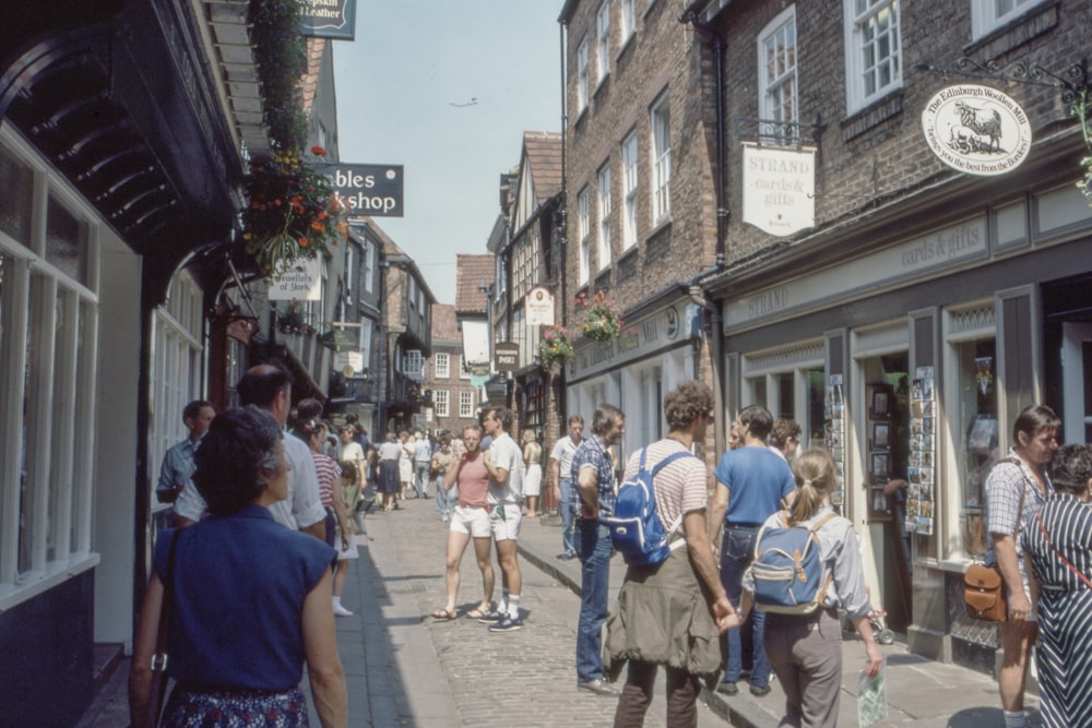 group of people walking on street during daytime