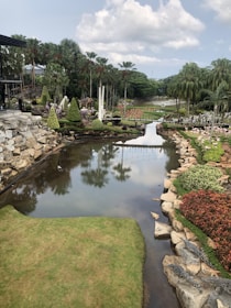 A peaceful garden view with a river in the background.
