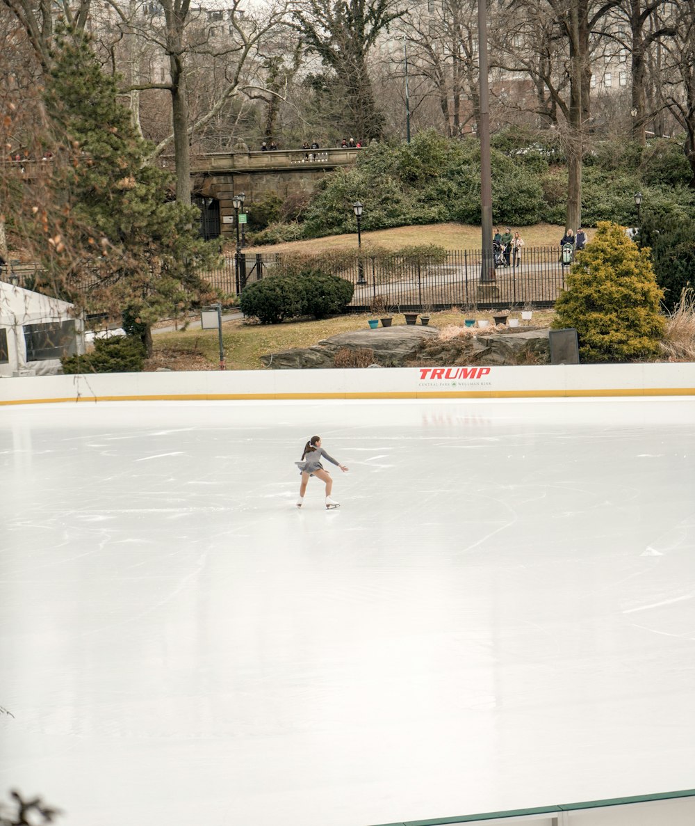 woman figure skating during daytime