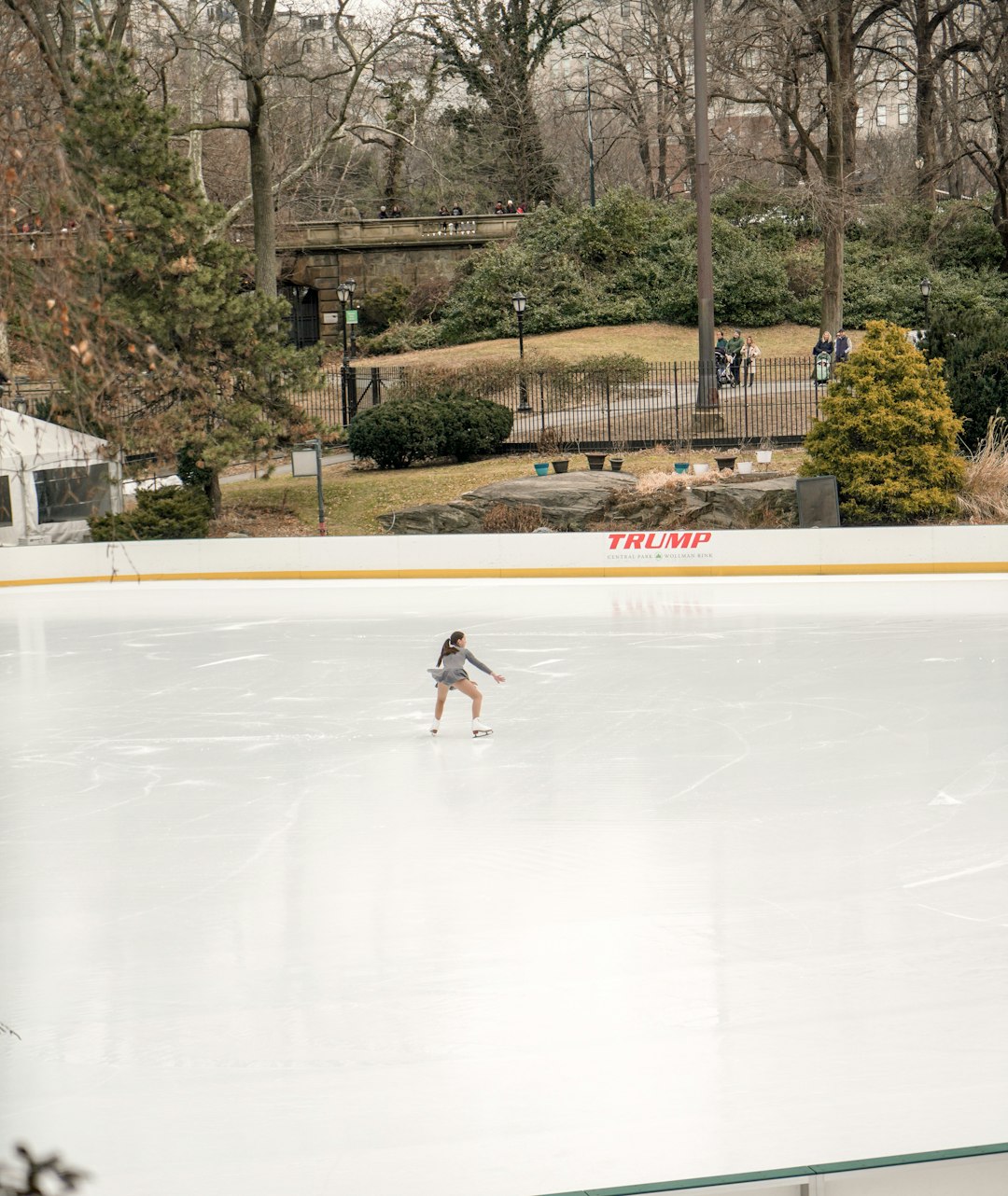 woman figure skating during daytime