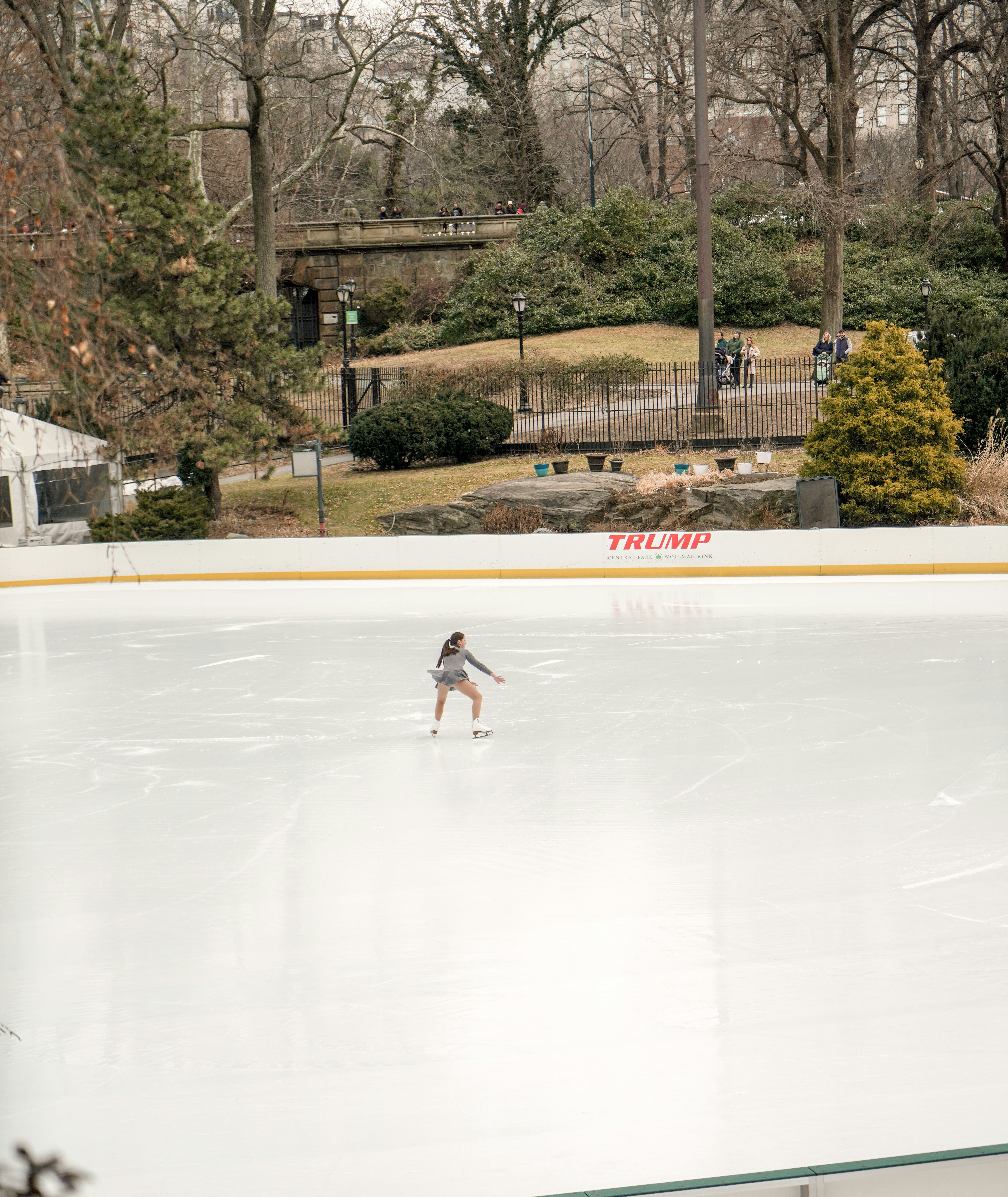 woman figure skating during daytime