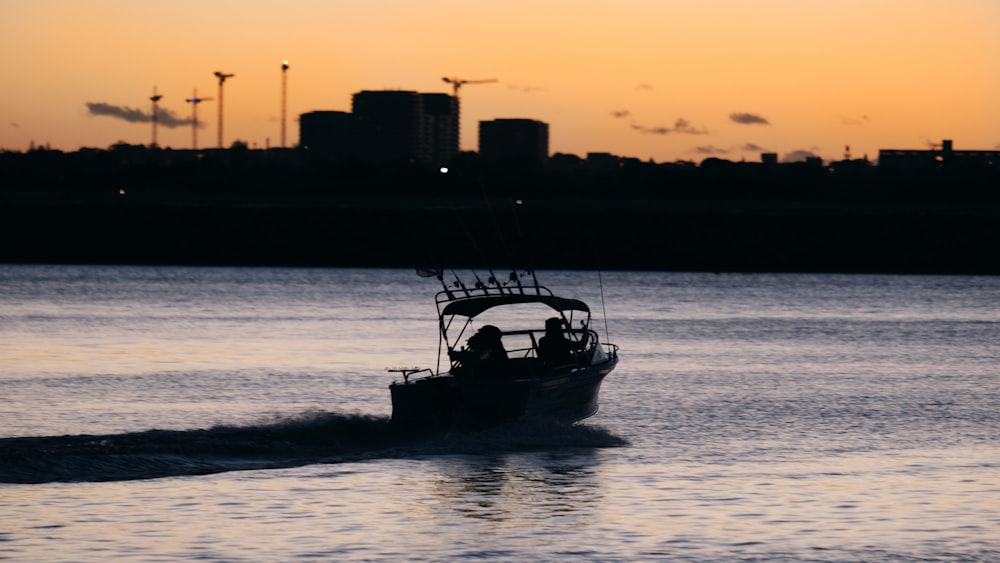 person riding powerboat on body of water