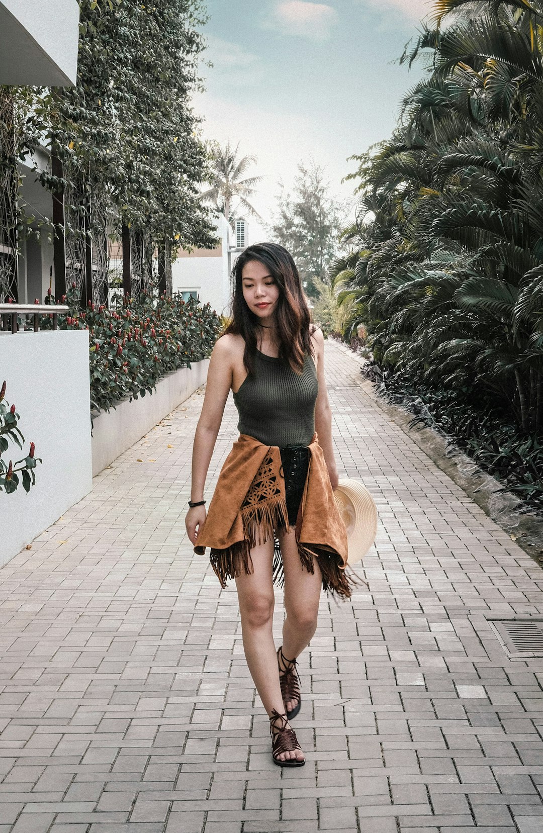 woman in grey sleeveless top