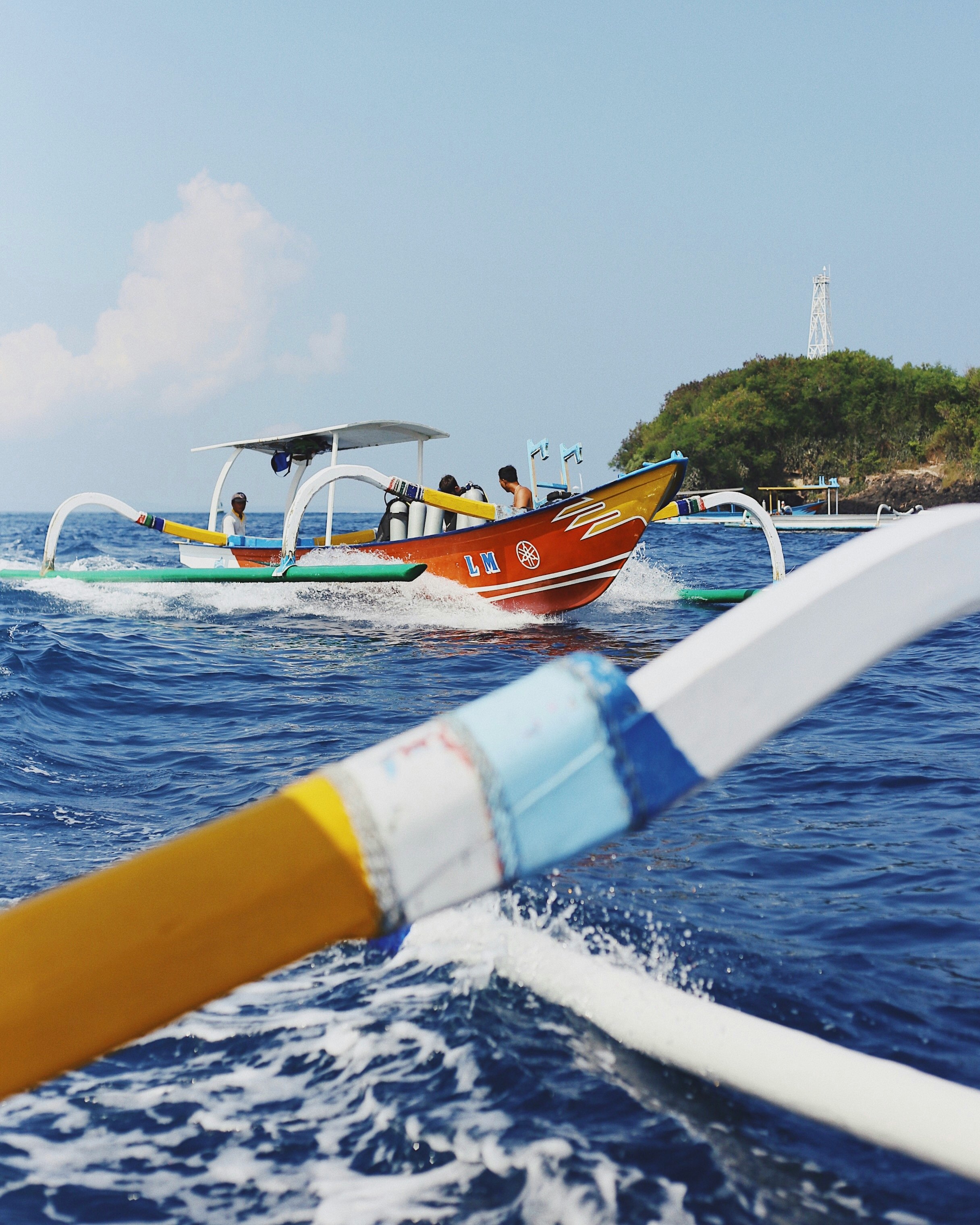 people riding on boat during daytime