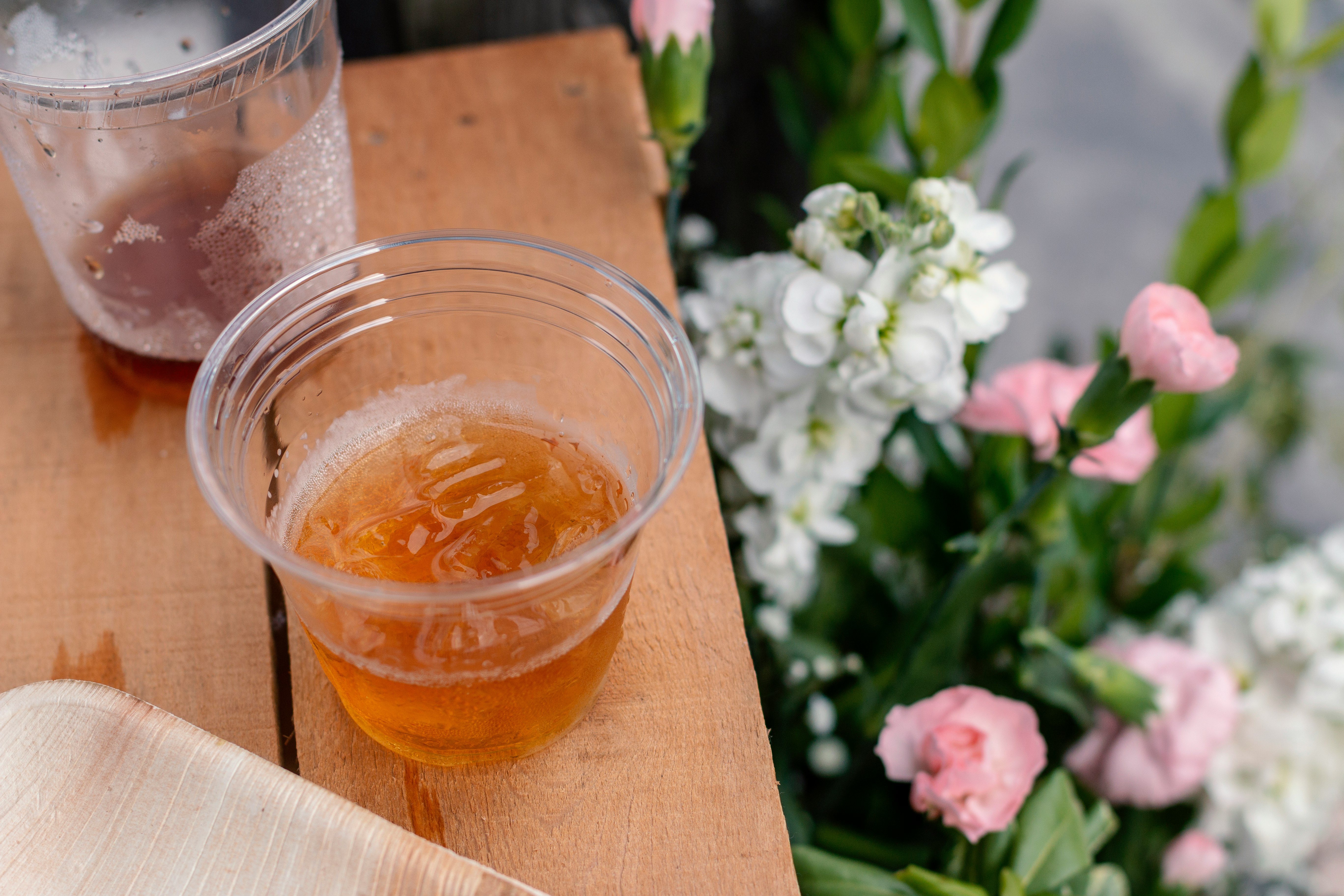 half-filled plastic cup on table