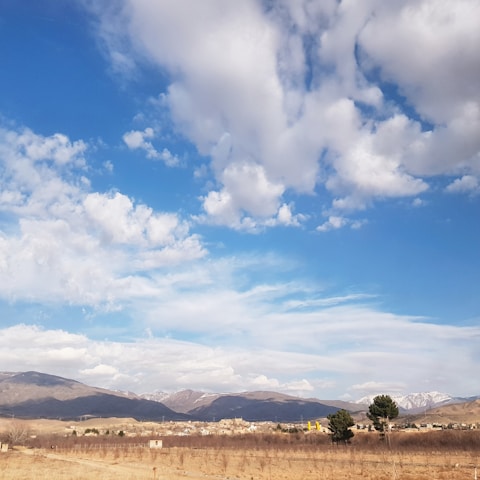 A panoramic view of a newly developed residential lot in Desaguadero, Puno, showing clear skies and natural surroundings.