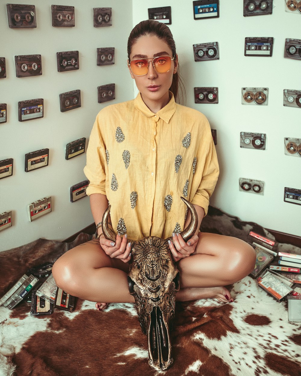 woman holding animal skull