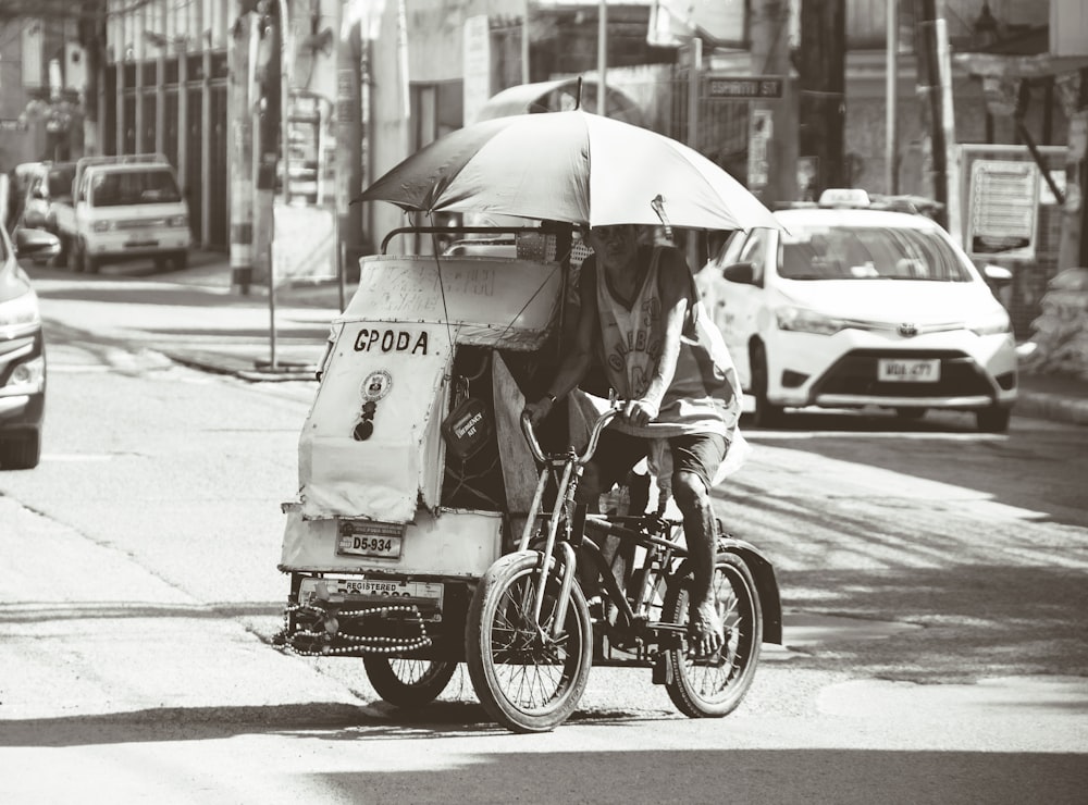 man riding a tricycle