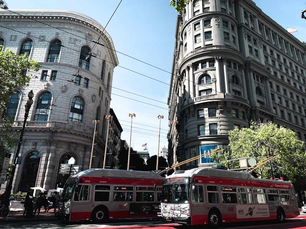 gray and red transit bus on street