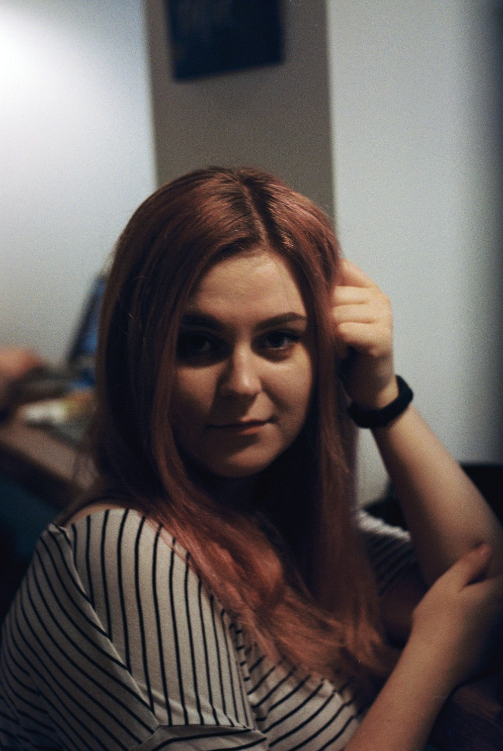 woman wearing white and black striped shirt