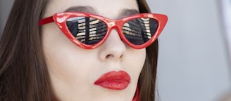 woman wearing classic red framed sunglasses