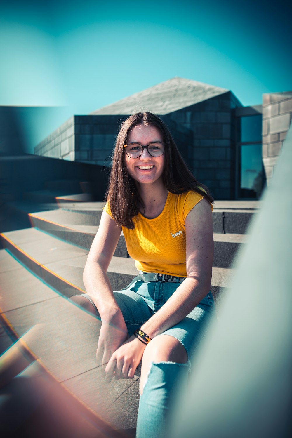 woman sitting on concrete stairs