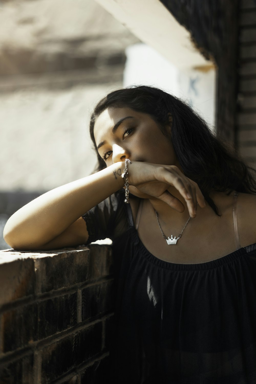 woman leaning on wall