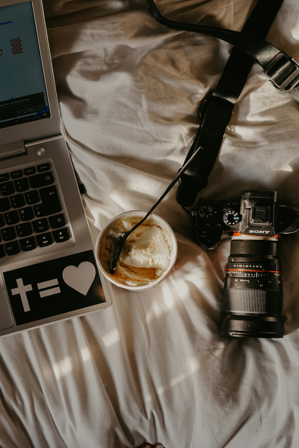 Sony DSLR camera beside dessert food