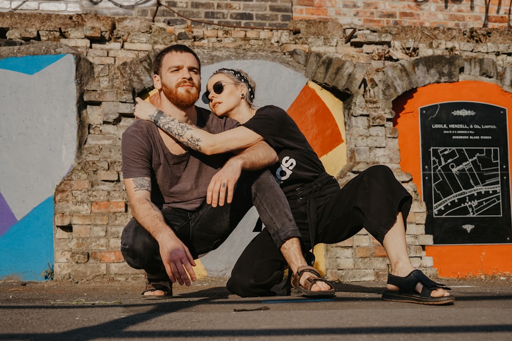 man leaning and hugging man wearing gray shirt