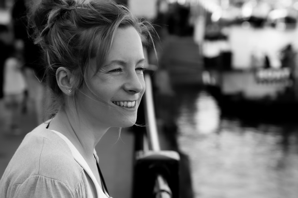 grayscale photography of woman smiling