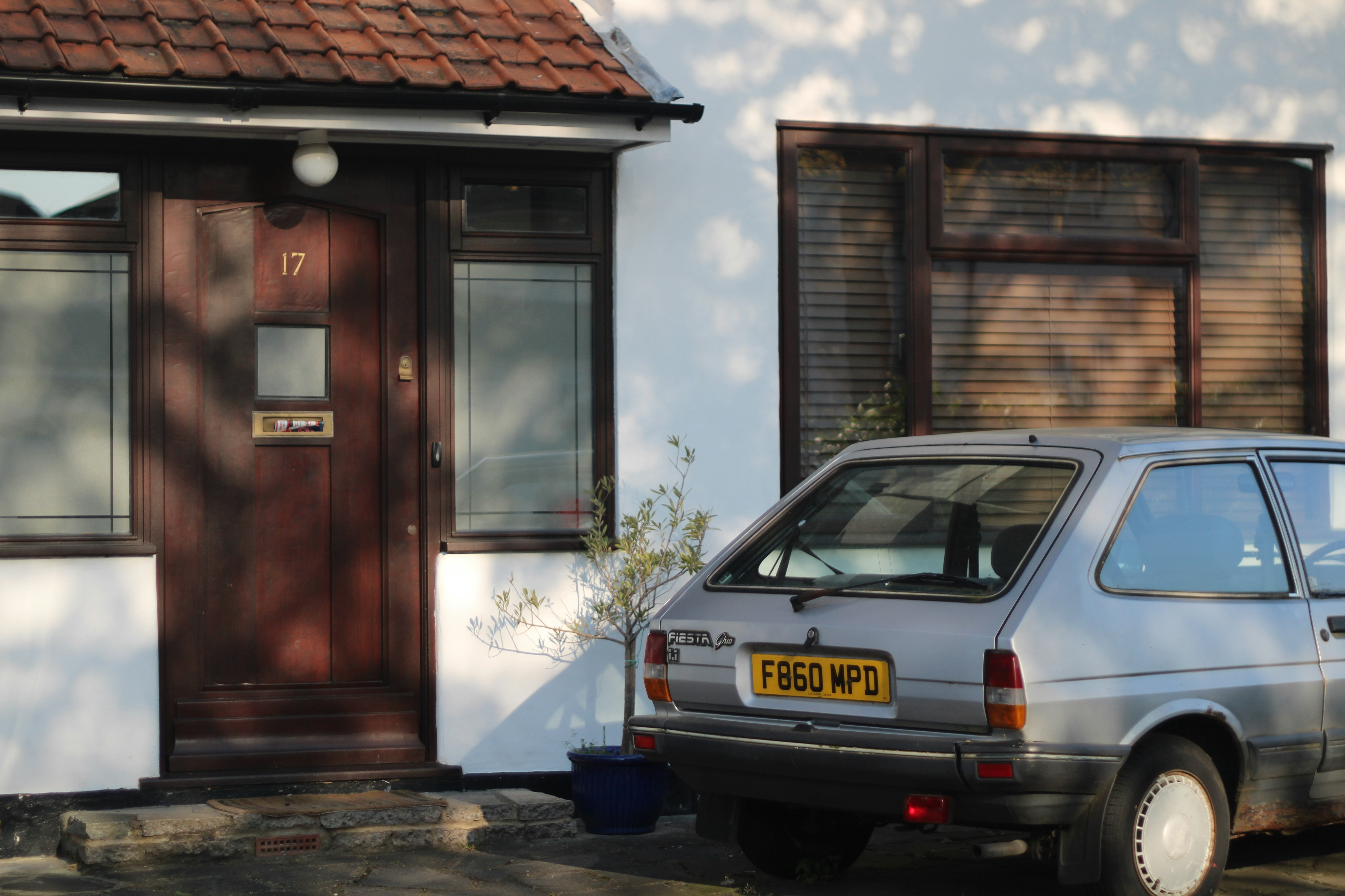 A family car parked in a driveway