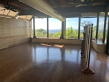 A spacious room with large windows offering a beautiful view.