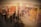 A gallery setting containing large, vibrant abstract paintings with circular and floral motifs. The artworks are predominantly in warm colors, and there are several people viewing the display, their reflections creating a layered effect. The scene feels dynamic due to the overlapping silhouettes of the viewers.